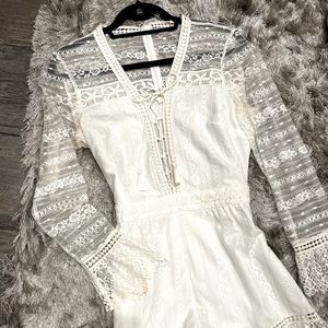 Saylor size L white lace long sleeve romper.  Excellent condition.